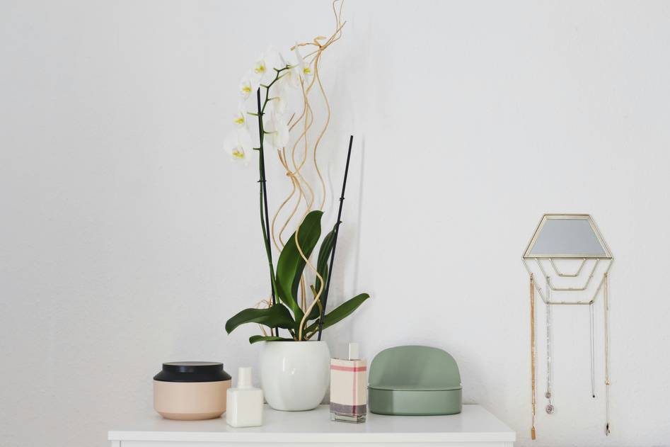 Elegant wooden decorative box with brass accents on a neutral table